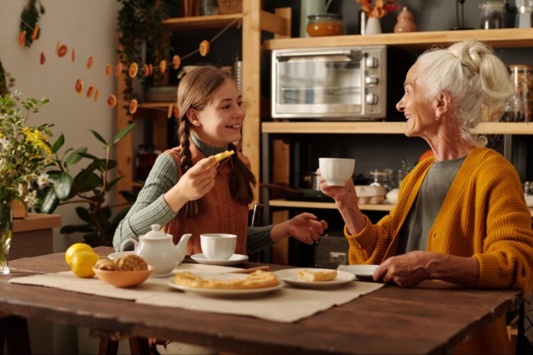 Grandmother and granddaughter enjoying the peace of mind that comes from financial planning for elderly parents.