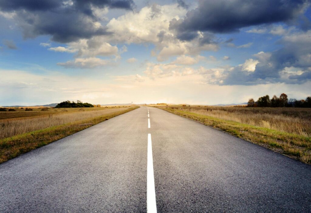 Straight road heading towards an appealing horizon, to demonstrate the appeal of a simplified retirement plan for self-employed individuals