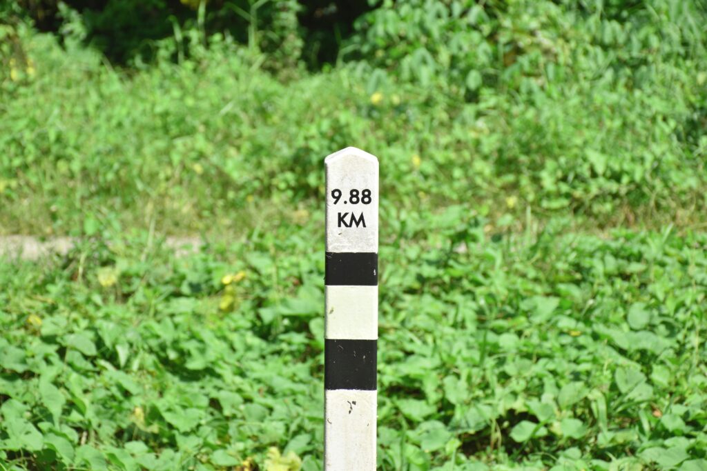 9.88 km marker on a nature walk to represent the importance of purposeful milestones in financial planning for attorneys