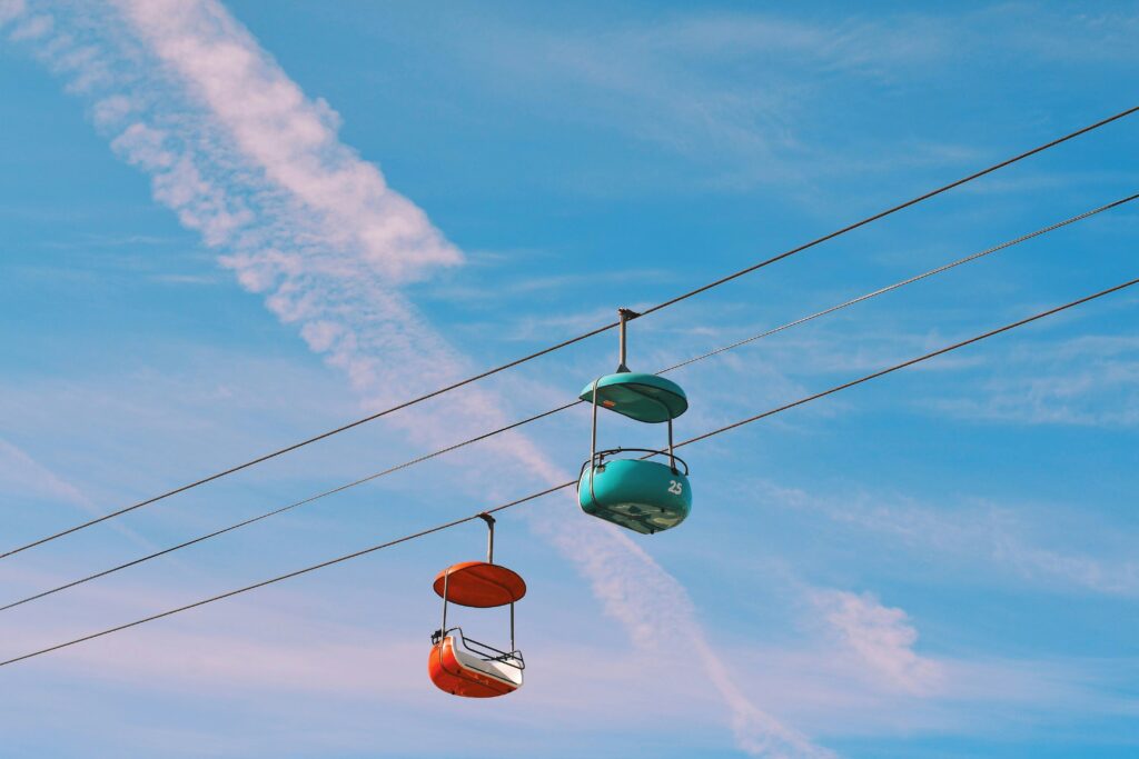 Two suspended chairs in different colors mimic the two additional options to be discussed.