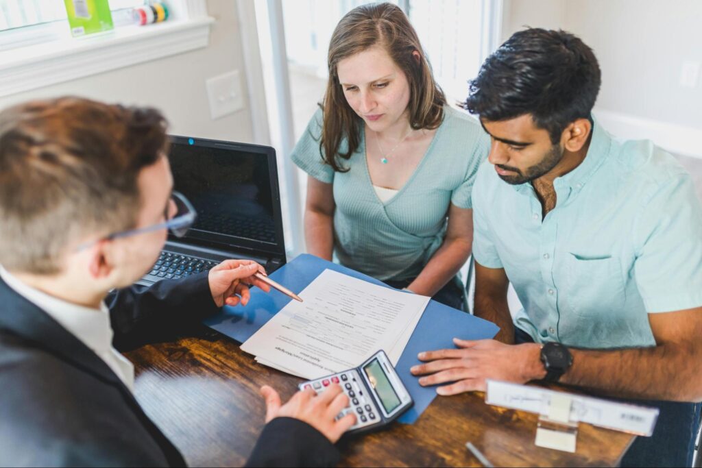A couple meets with a financial planning specialist.