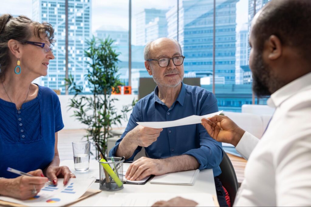 A couple working with an advisor on estate planning for generational wealth.