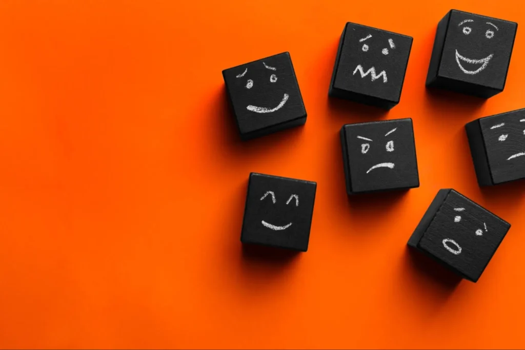 The emotions seen on the black blocks represent some of the emotions that can lead to emotional investing.